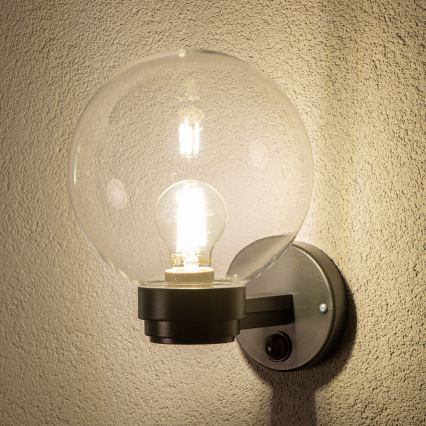 Brilagi - Buitenwandlamp met bewegingssensor HARBOR 1xE27/40W/230V IP33 zwart/helder
